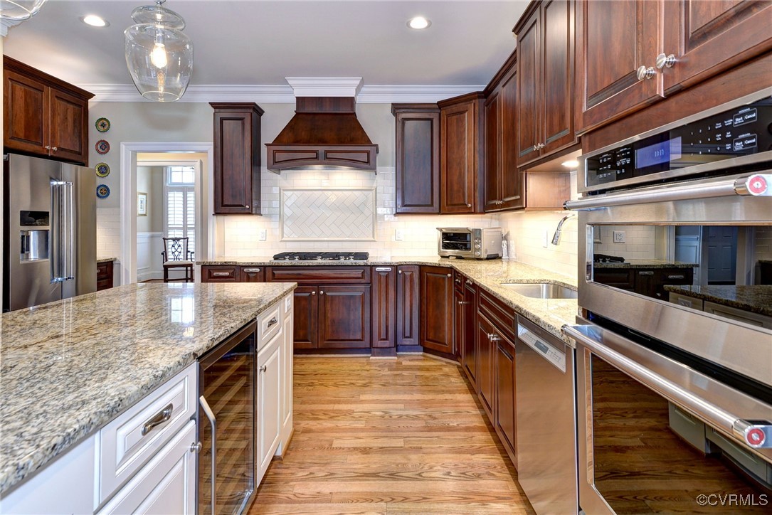104 Edenbridge Williamsburg, VA 23188 - Photo 16 of 50 a kitchen with stainless steel appliances granite countertop sink stove and cabinets