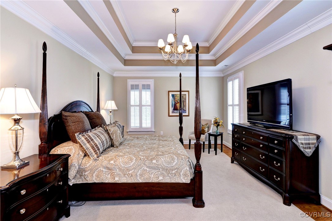 104 Edenbridge Williamsburg, VA 23188 - Photo 23 of 50 a bedroom with a bed and a flat tv screen on dresser