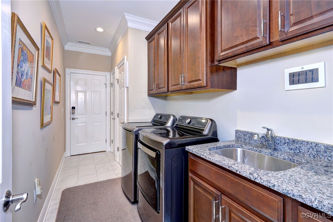104 Edenbridge Williamsburg, VA 23188 - Photo 29 of 50 a kitchen with stainless steel appliances granite countertop a sink stove and refrigerator