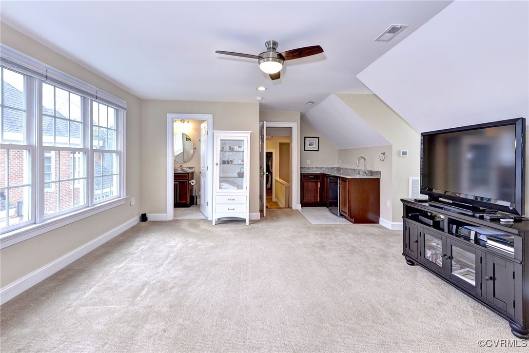 104 Edenbridge Williamsburg, VA 23188 - Photo 36 of 50 an empty room with furniture and a flat screen tv