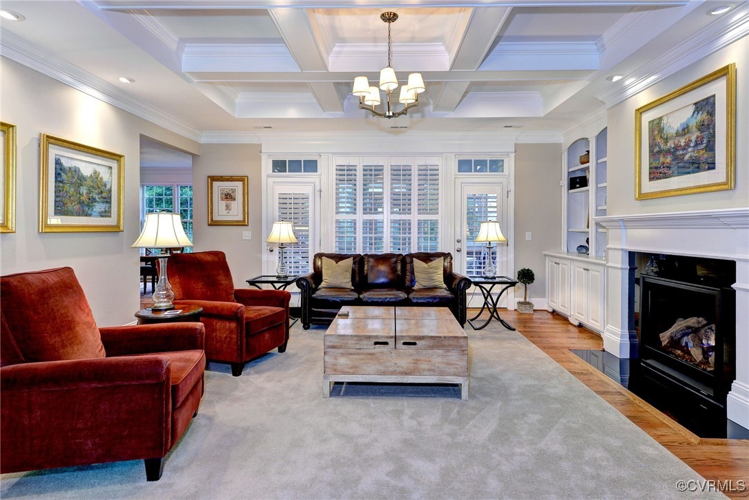 104 Edenbridge Williamsburg, VA 23188 - Photo 7 of 50 a living room with furniture a fireplace and a chandelier