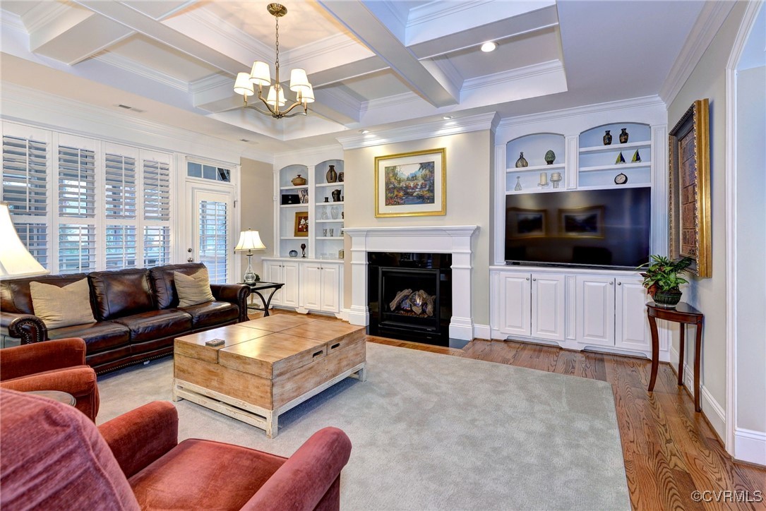 104 Edenbridge Williamsburg, VA 23188 - Photo 8 of 50 a living room with furniture a flat screen tv and a fireplace