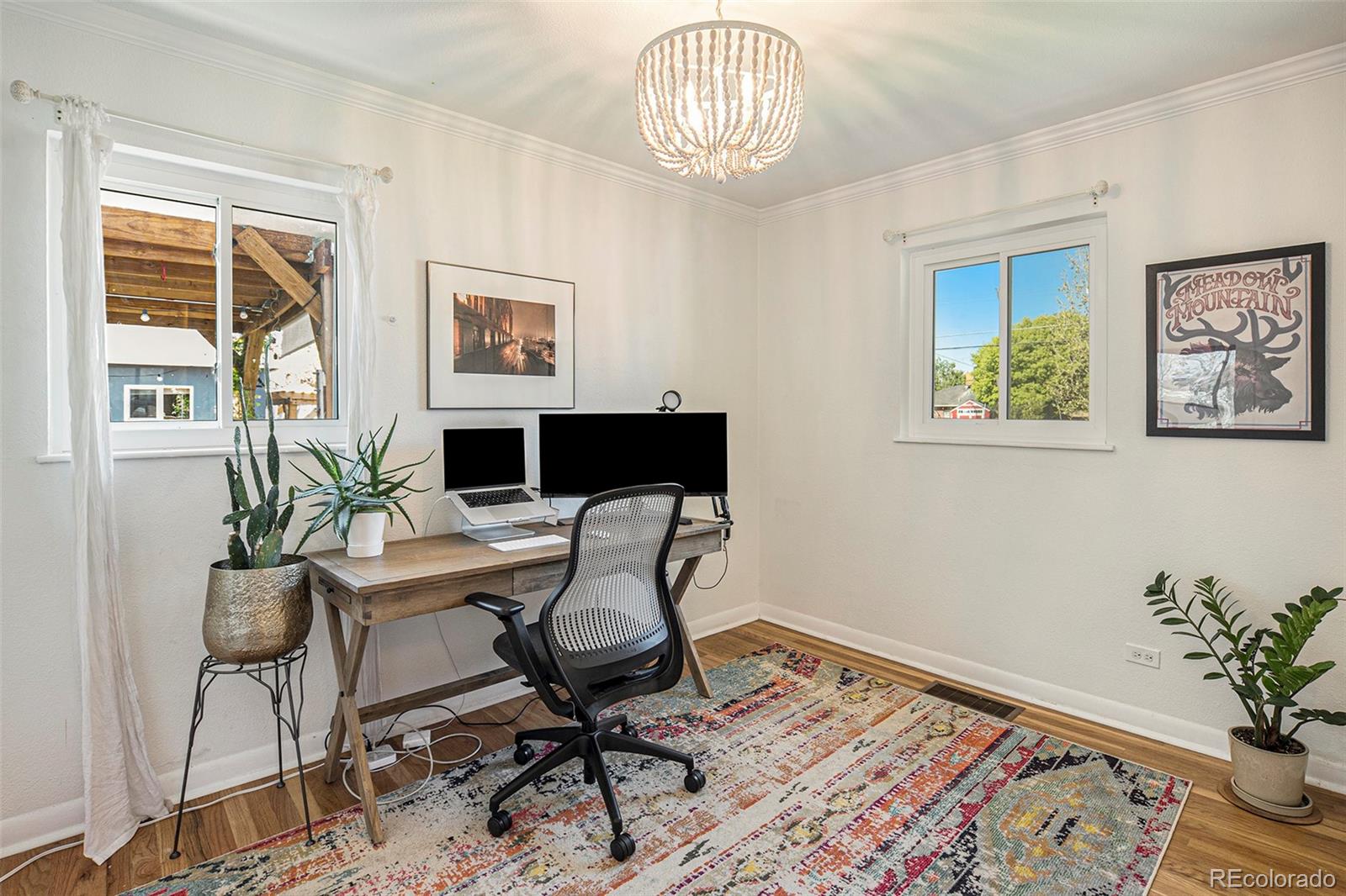 3621 Oneida Street Denver, CO 80207 - Photo 15 of 35 a workspace with furniture window and wooden floor