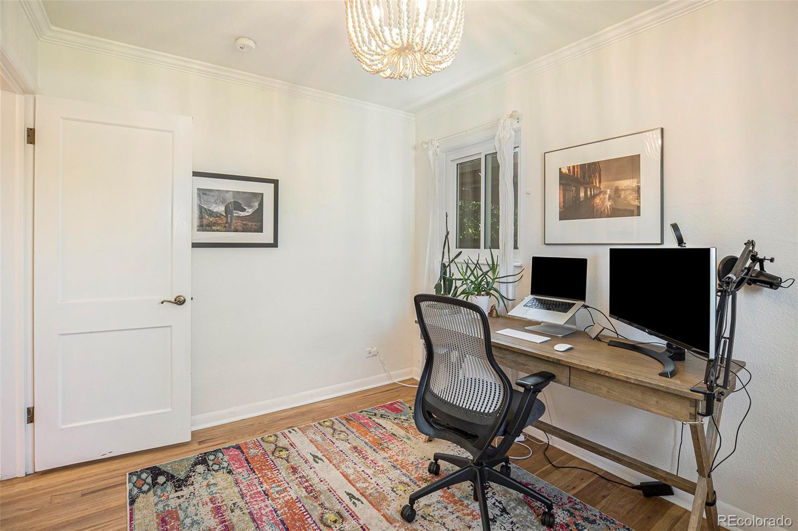 3621 Oneida Street Denver, CO 80207 - Photo 16 of 35 a workspace with furniture and wooden floor