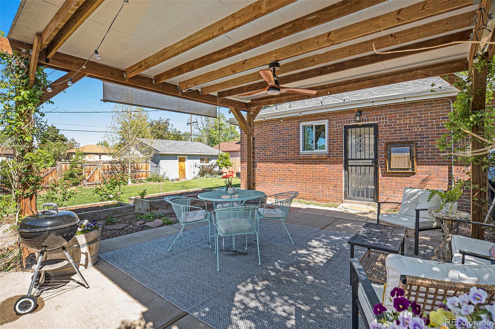 3621 Oneida Street Denver, CO 80207 - Photo 25 of 35 a view of a dining room with furniture and window