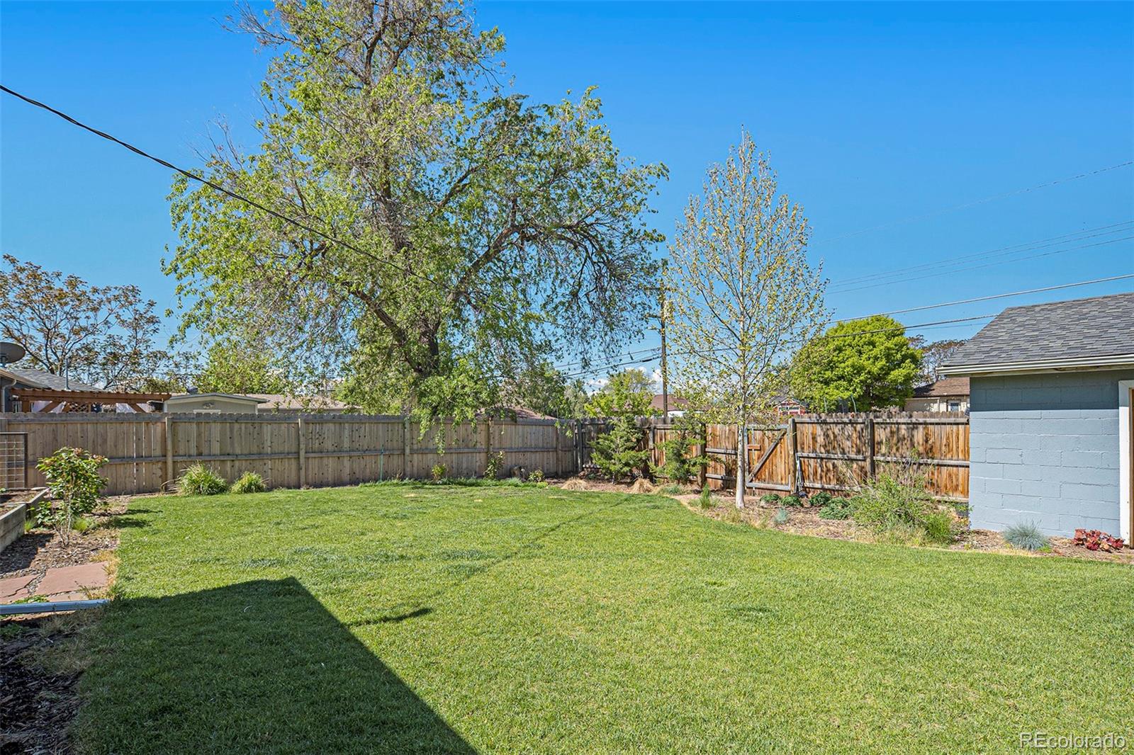 3621 Oneida Street Denver, CO 80207 - Photo 29 of 35 a view of a chair and table in backyard of the house