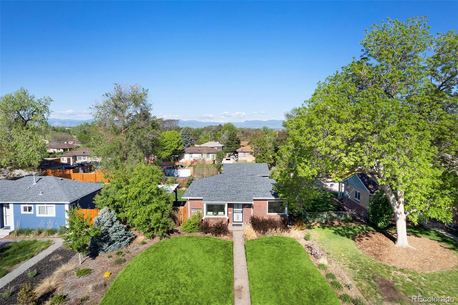 3621 Oneida Street Denver, CO 80207 - Photo 35 of 35 an aerial view of residential houses with outdoor space and trees