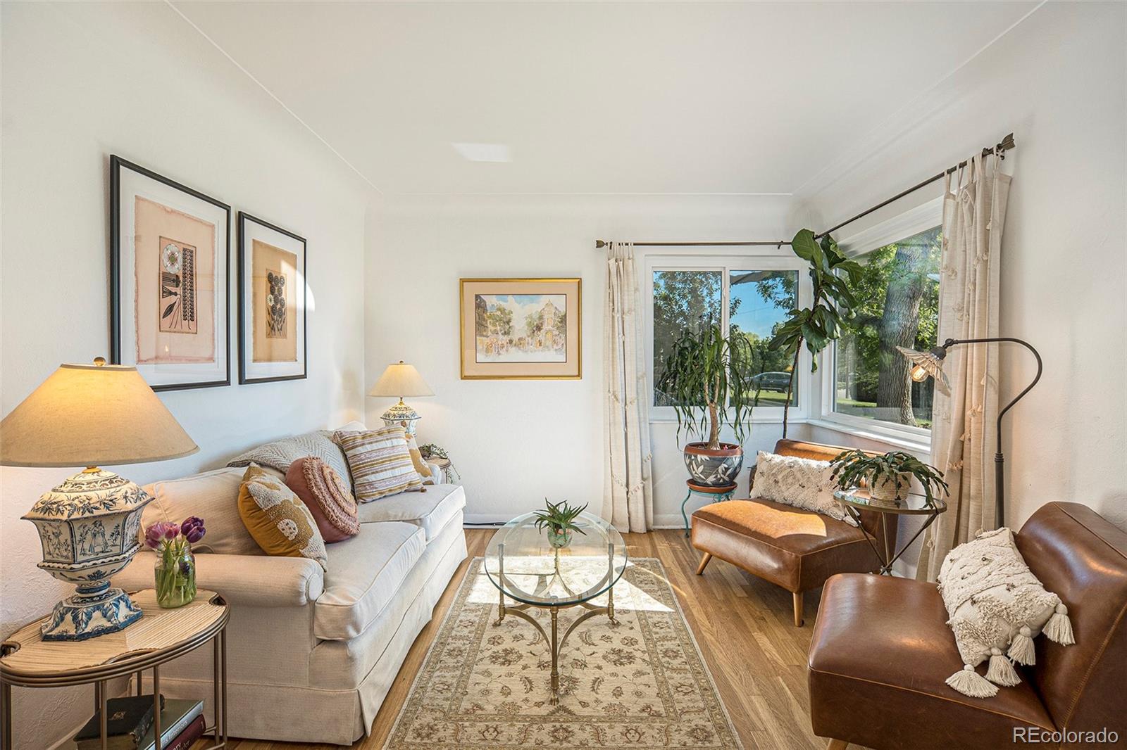 3621 Oneida Street Denver, CO 80207 - Photo 5 of 35 a living room with furniture and a large window