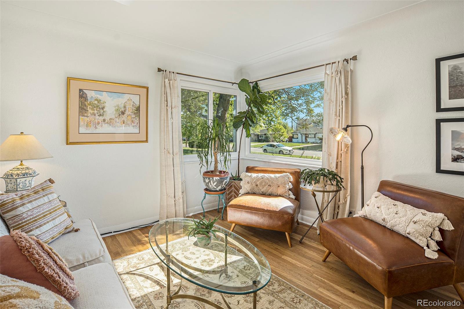 3621 Oneida Street Denver, CO 80207 - Photo 6 of 35 a living room with furniture and a large window