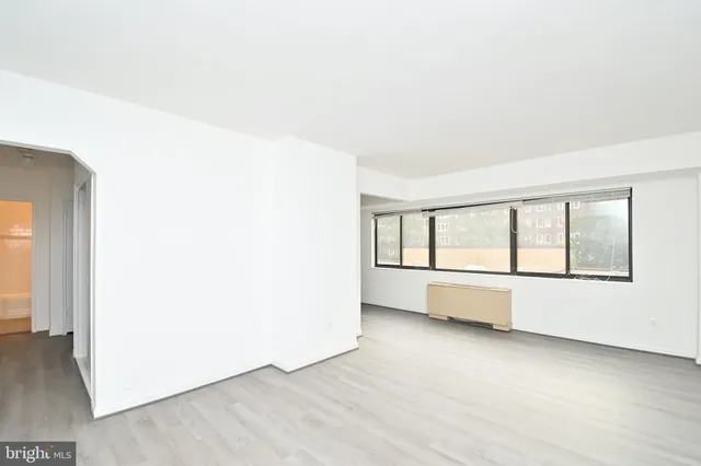 a view of an empty room with a window