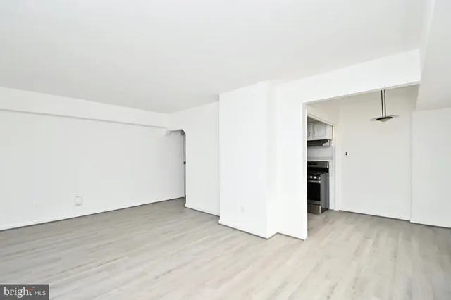 an empty room with wooden floor