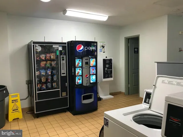 a kitchen with a refrigerator and a stove