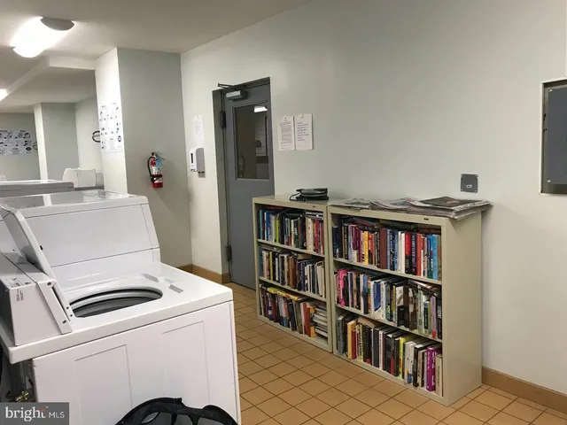 a room with a book shelf and a book shelf