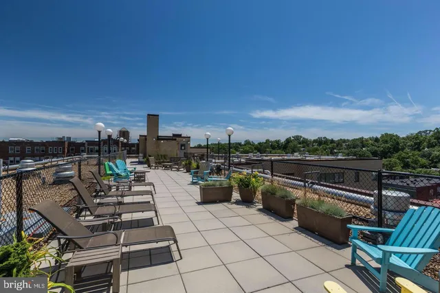 a view of roof deck with seating area