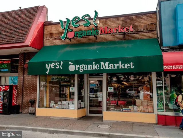 a view of a building with car parked