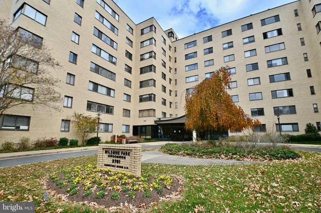 front view of a building with a garden