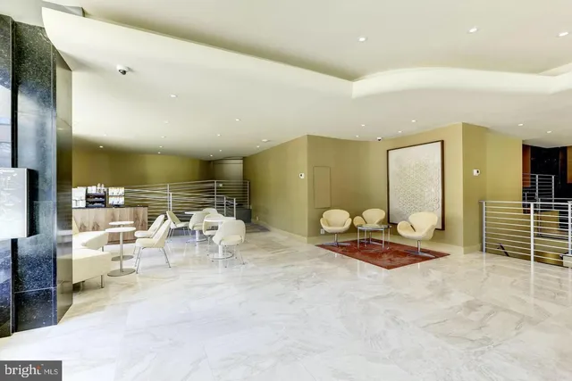 a living room with lots of furniture and gym equipment