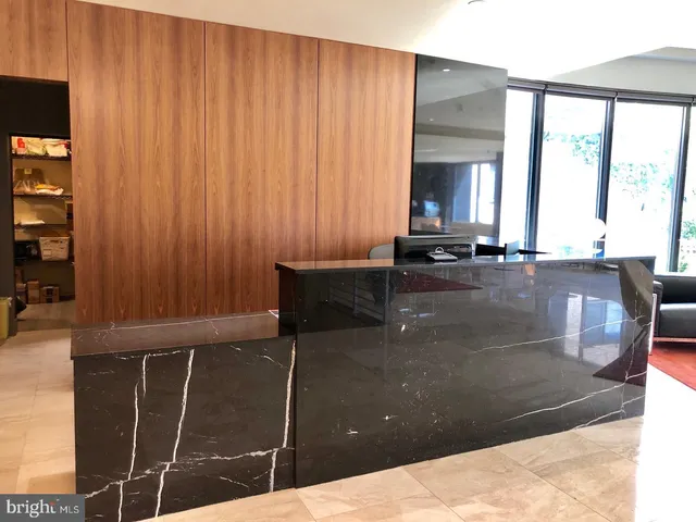 a kitchen with a sink and large window