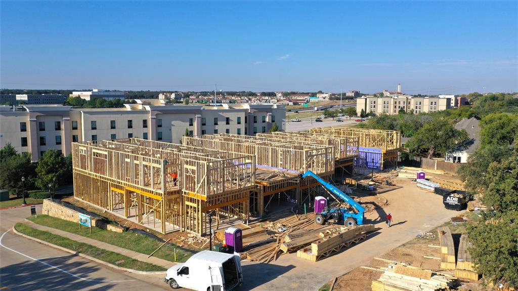 103 Beldonia Court Trophy Club, TX 76262 - Photo 5 of 7 a view of roof deck with outdoor seating and city view