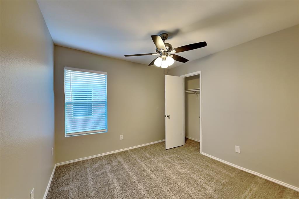 8844 Quarry Ridge Trail Fort Worth, TX 76244 - Photo 11 of 18 Unfurnished bedroom featuring carpet, a closet, and ceiling fan