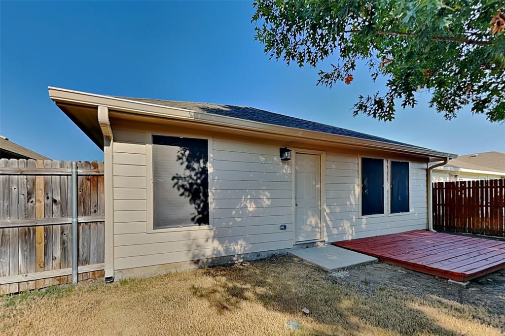 8844 Quarry Ridge Trail Fort Worth, TX 76244 - Photo 15 of 18 Rear view of property with a wooden deck and a shingled roof