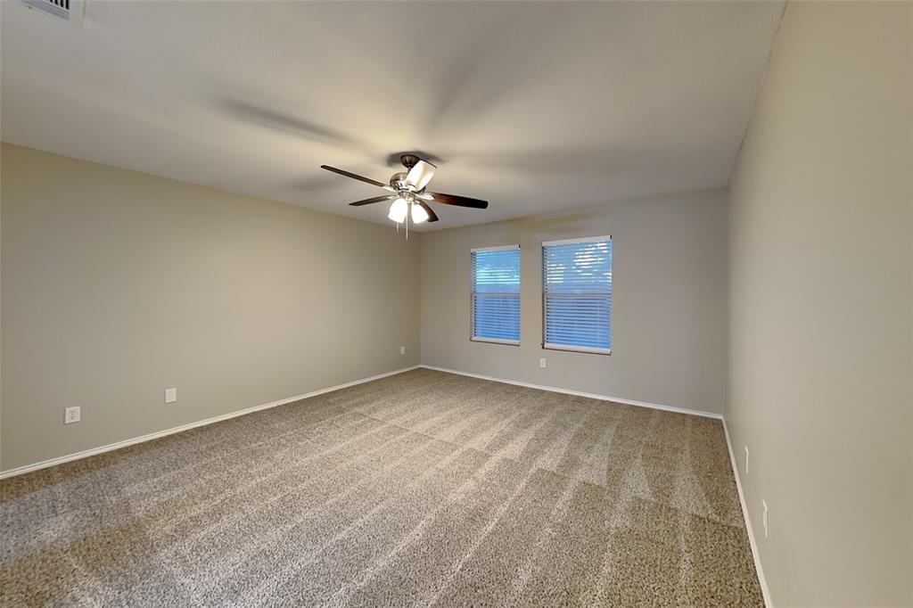 8844 Quarry Ridge Trail Fort Worth, TX 76244 - Photo 5 of 18 Carpeted empty room with baseboards and ceiling fan