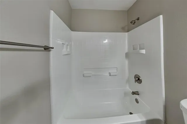 a bathroom with a sink toilet and mirror
