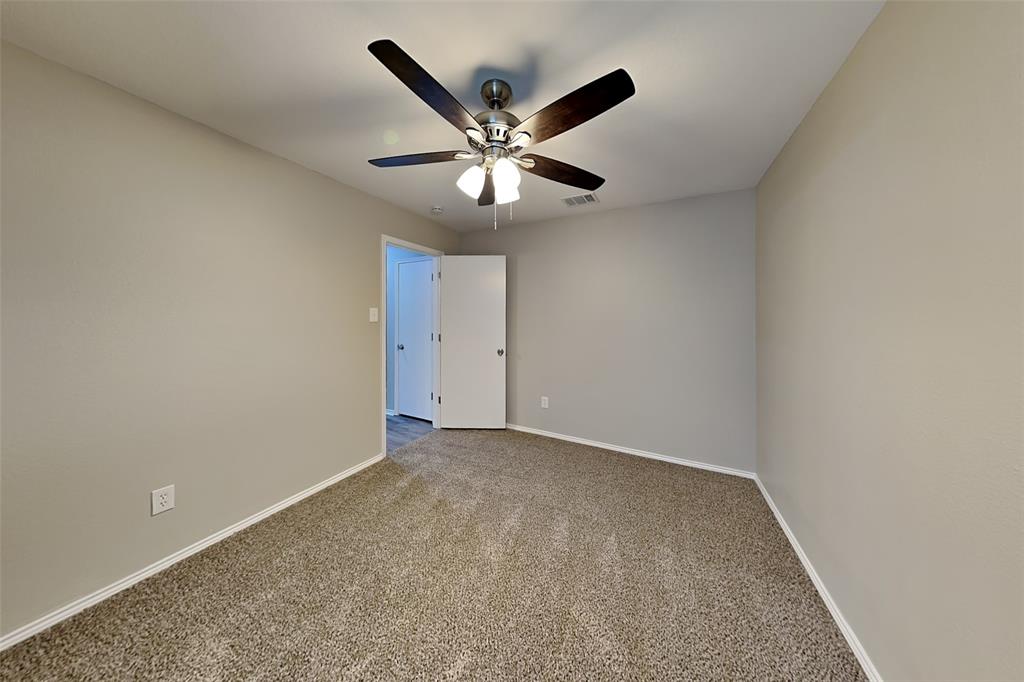 8844 Quarry Ridge Trail Fort Worth, TX 76244 - Photo 9 of 18 Carpeted empty room featuring baseboards and ceiling fan