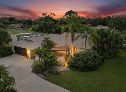 a view of a garden with a building in the background
