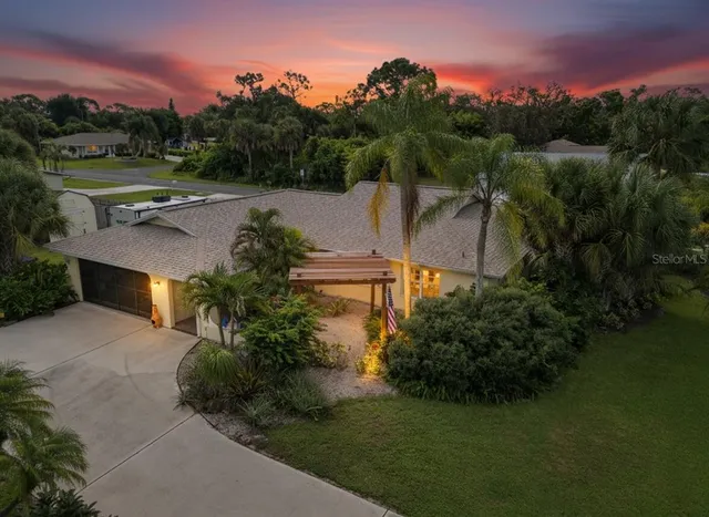 a view of a garden with a building in the background