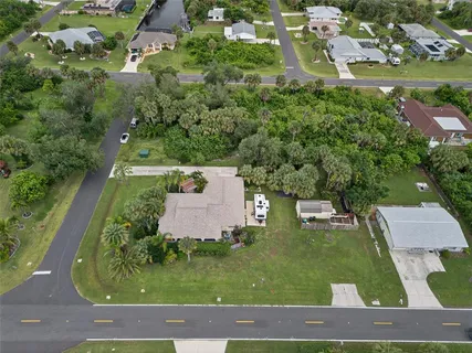 a view of a swimming pool with a yard