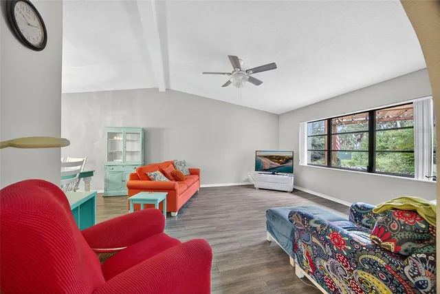 a living room with furniture and a window