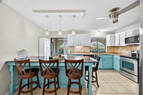 a kitchen with counter top space cabinets and stainless steel appliances