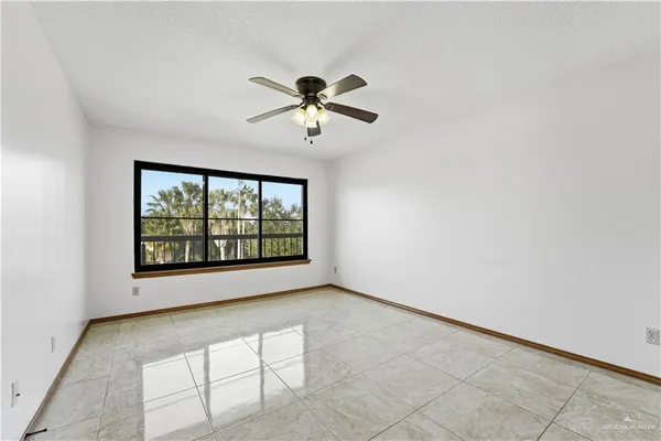 a bathroom with a granite countertop sink mirror and shower