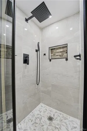 a bathroom with a granite countertop toilet a sink and a mirror