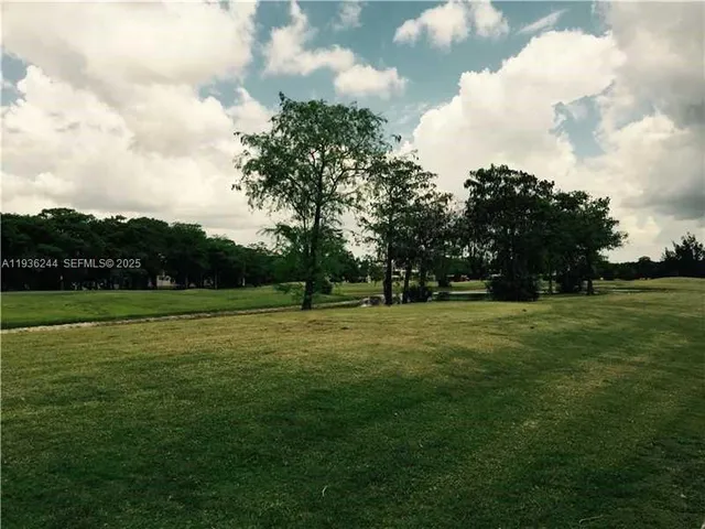 a kitchen with a sink stove and microwave