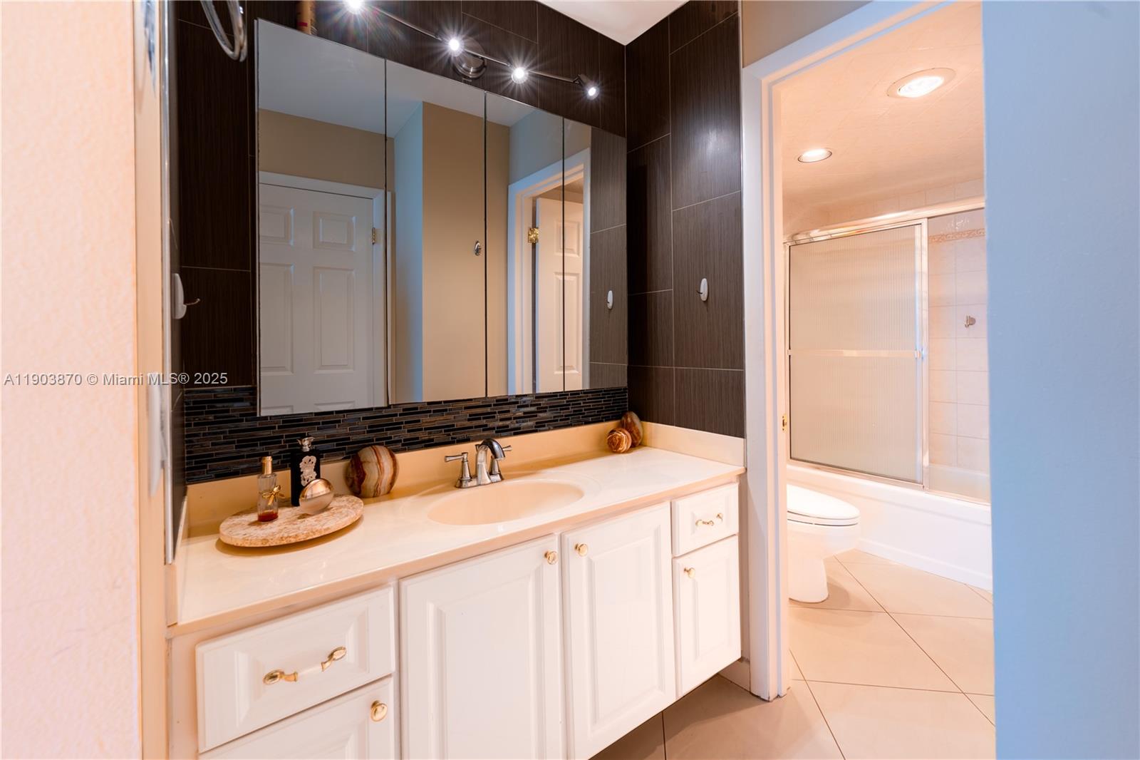 2101 South Ocean Drive, Unit 2002 Hollywood, FL 33019 - Photo 17 of 23 a bathroom with a sink and a mirror