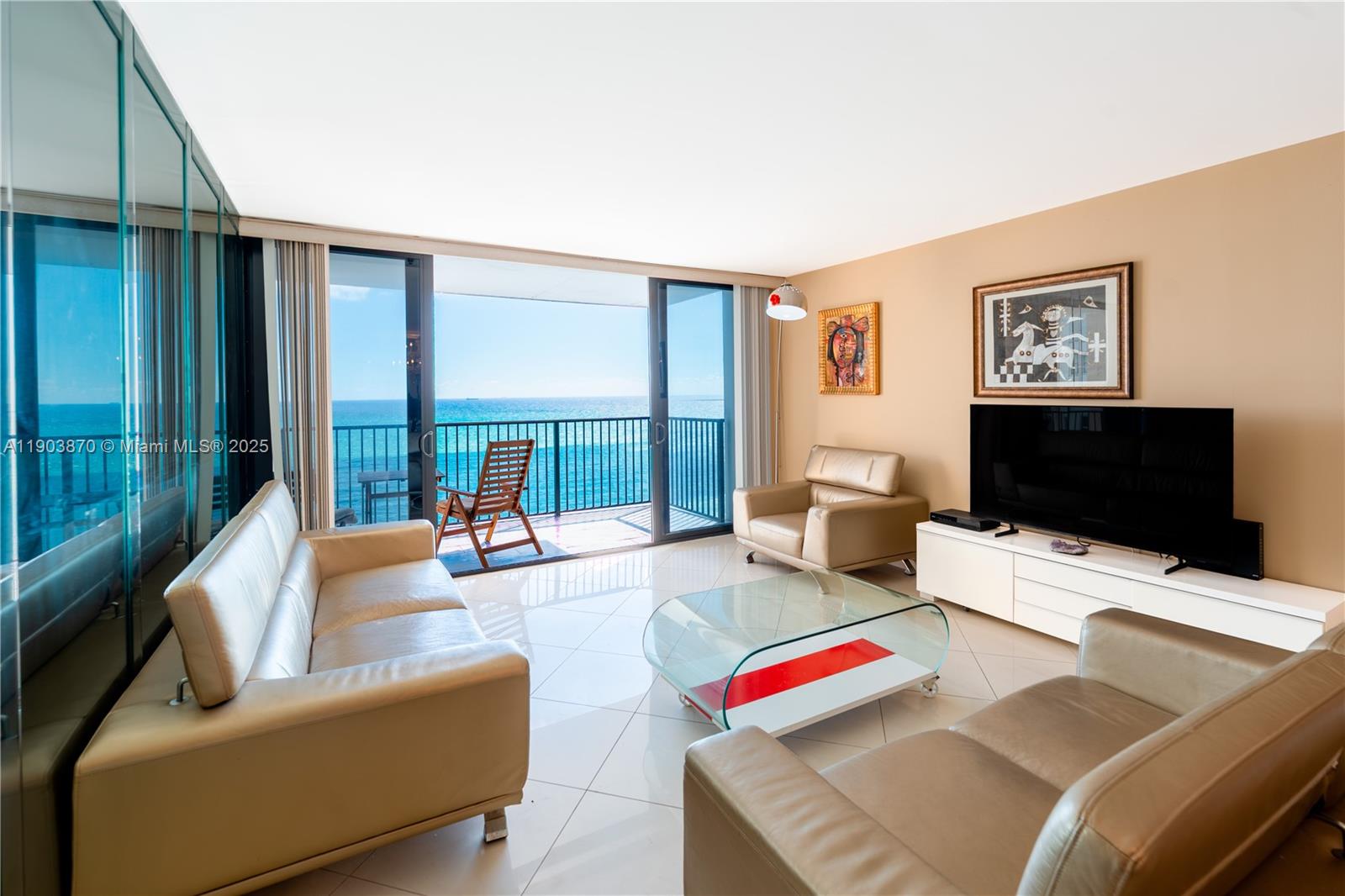 2101 South Ocean Drive, Unit 2002 Hollywood, FL 33019 - Photo 3 of 23 a living room with furniture and a flat screen tv