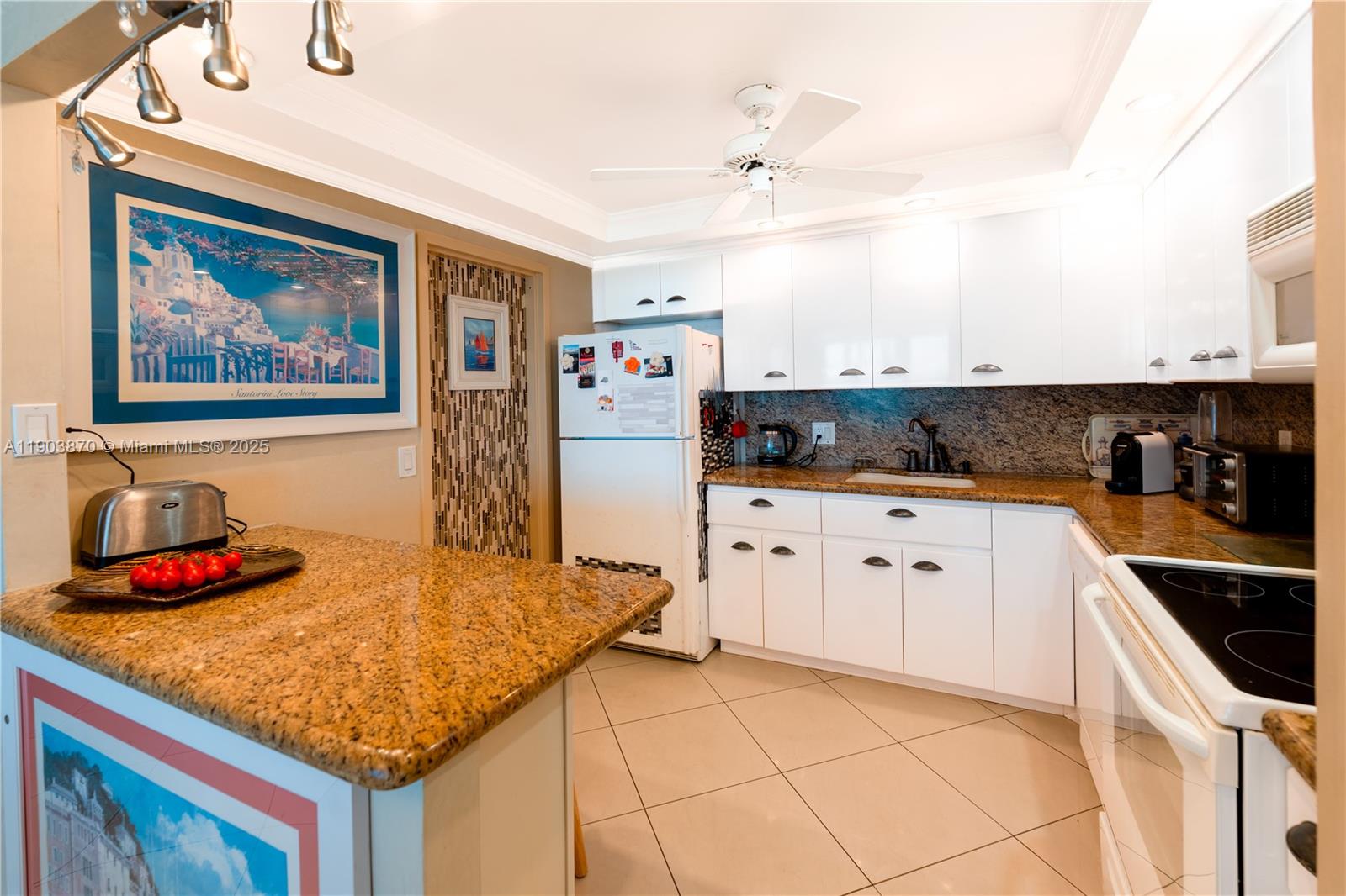2101 South Ocean Drive, Unit 2002 Hollywood, FL 33019 - Photo 10 of 23 a kitchen with stainless steel appliances granite countertop a sink and cabinets