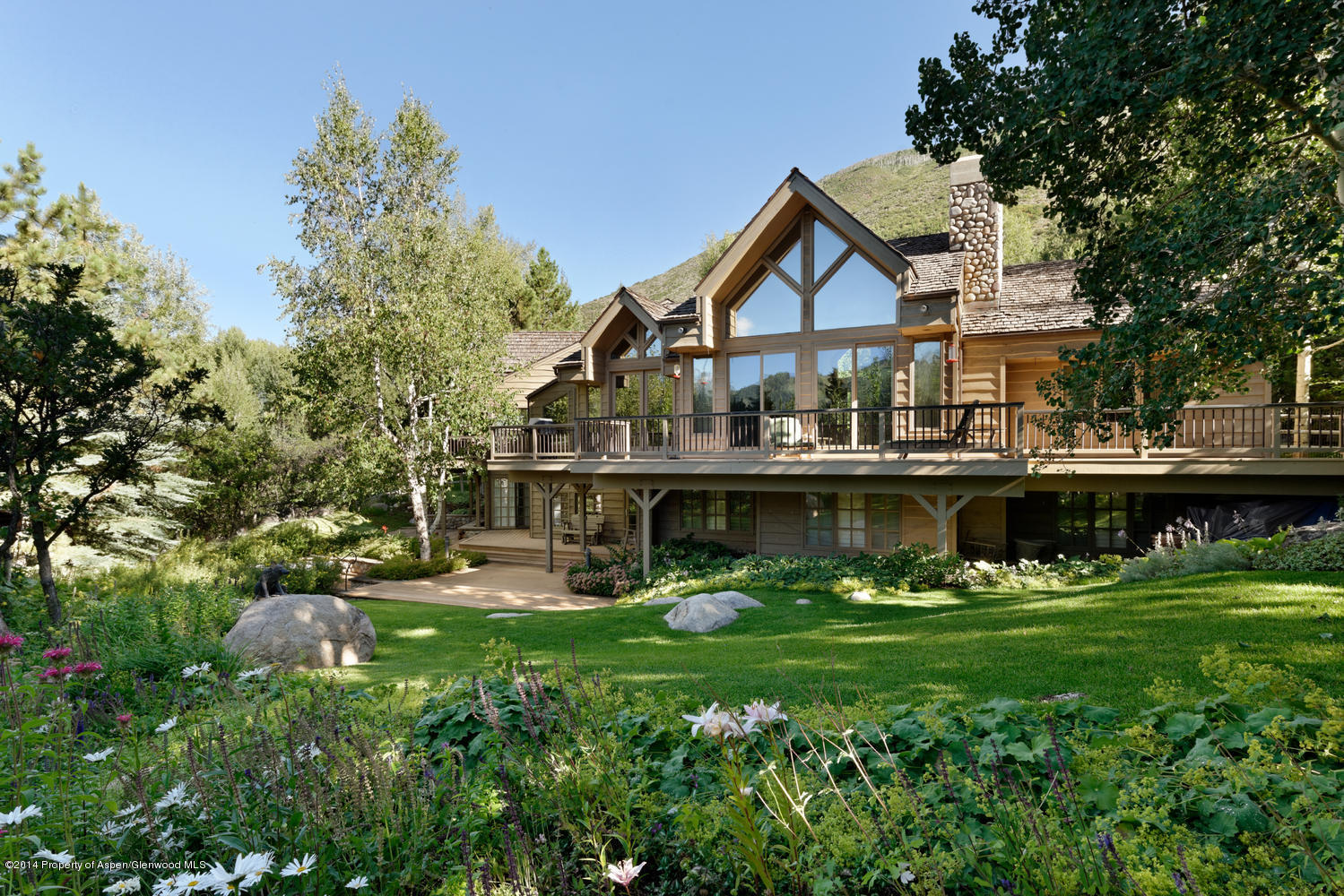 446 East Reds Road Aspen, CO 81612 - Photo 3 of 11 a front view of a house with garden and trees