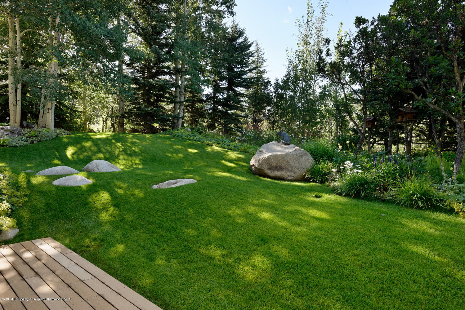 446 East Reds Road Aspen, CO 81612 - Photo 10 of 11 a backyard of a house with lots of green space