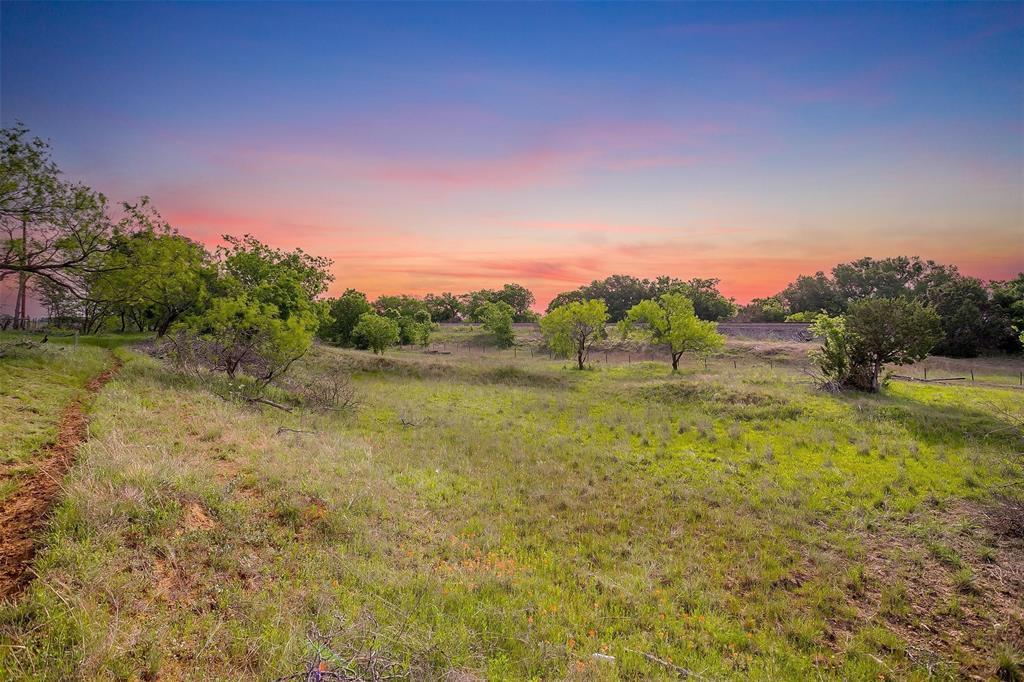 Tbd Tbd Tx-174 Rio Vista, TX 76093 - Photo 2 of 19 a view of a lake with a yard