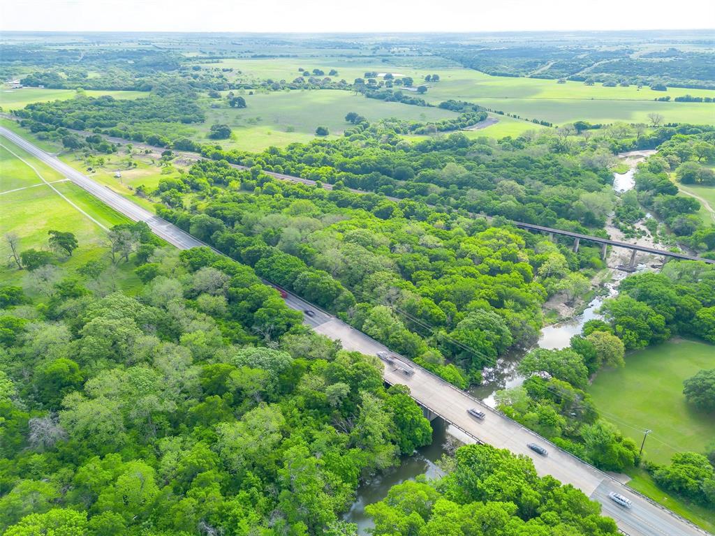 Tbd Tbd Tx-174 Rio Vista, TX 76093 - Photo 3 of 19 a view of a lush green field with lots of tall trees