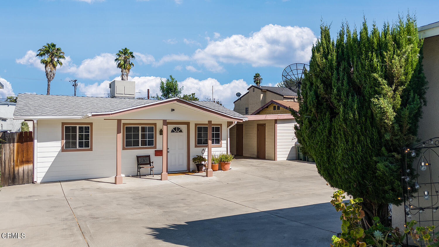 504 North Catalina Avenue Pasadena, CA 91106 - Photo 1 of 42 a view of a white house with a yard and potted plants