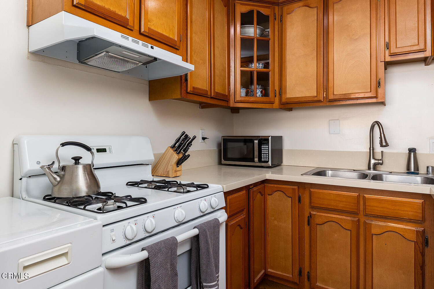 504 North Catalina Avenue Pasadena, CA 91106 - Photo 11 of 42 a kitchen with stainless steel appliances granite countertop a stove a sink and a microwave