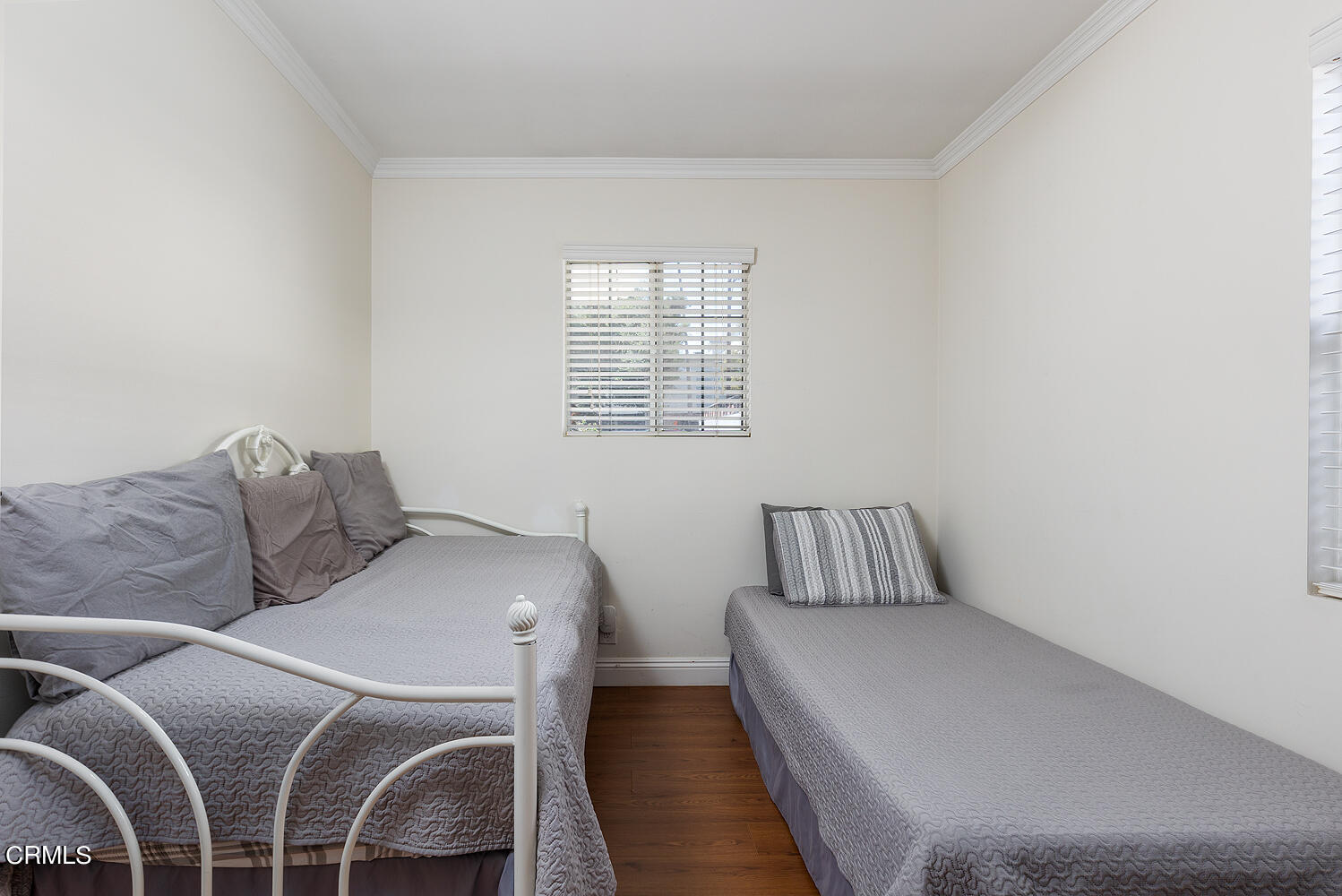 504 North Catalina Avenue Pasadena, CA 91106 - Photo 12 of 42 a bedroom with a bed and wooden floor