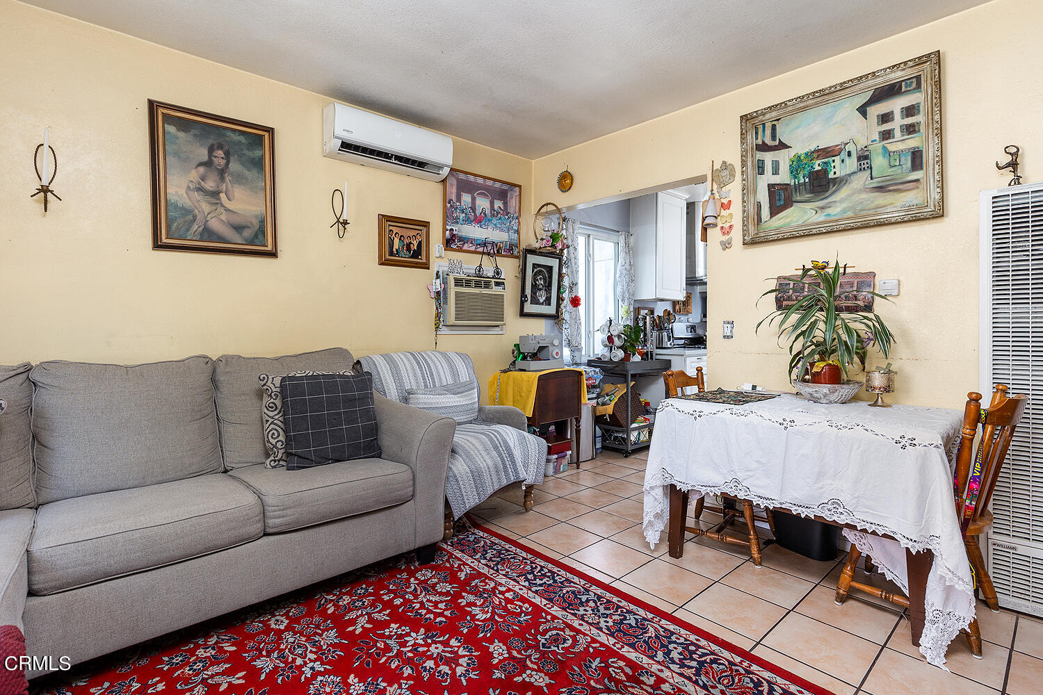 504 North Catalina Avenue Pasadena, CA 91106 - Photo 23 of 42 a living room with furniture a couch and paintings on the wall