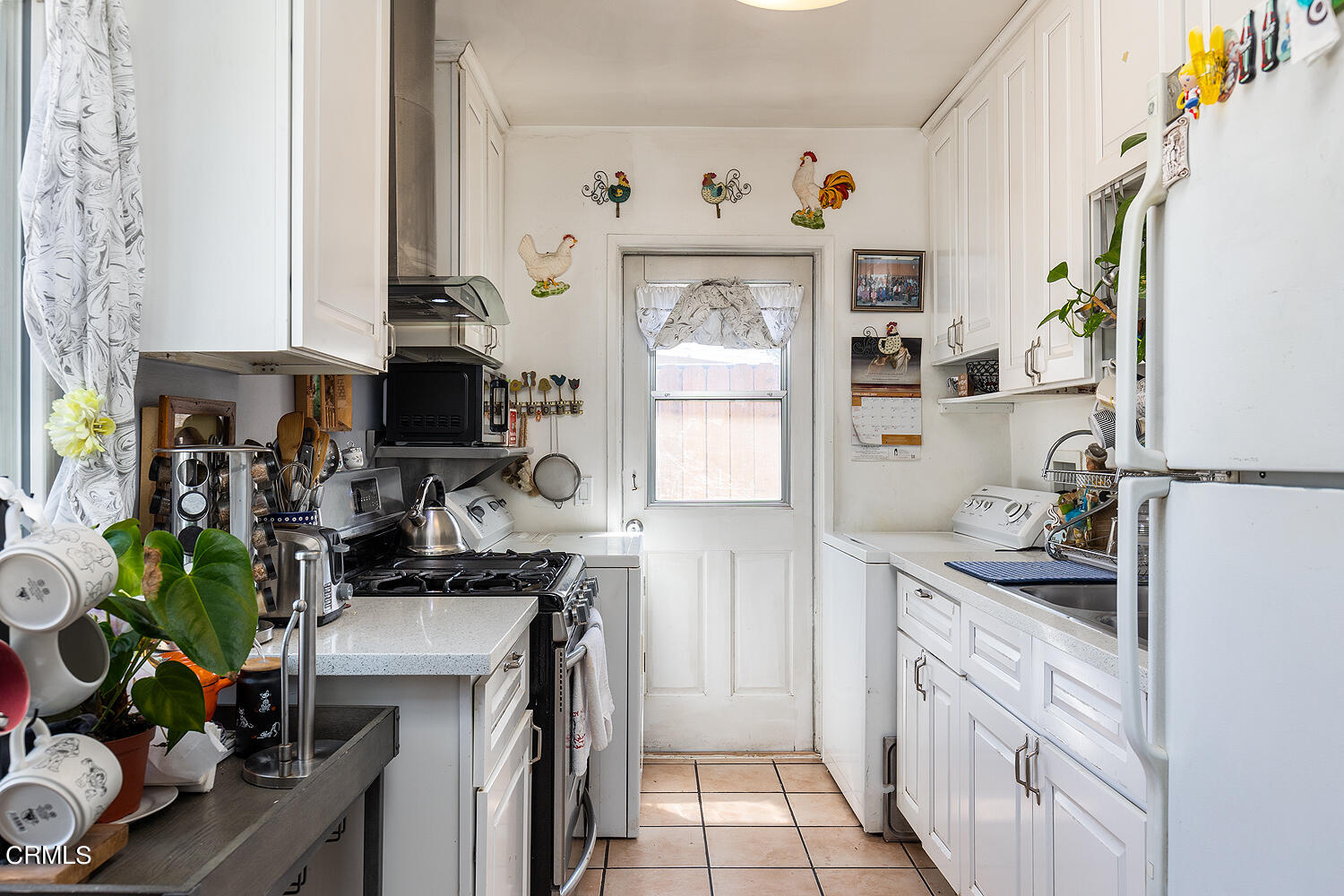 504 North Catalina Avenue Pasadena, CA 91106 - Photo 24 of 42 a kitchen with stainless steel appliances a white cabinets and a refrigerator