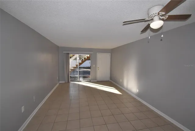 an empty room that has a window in it