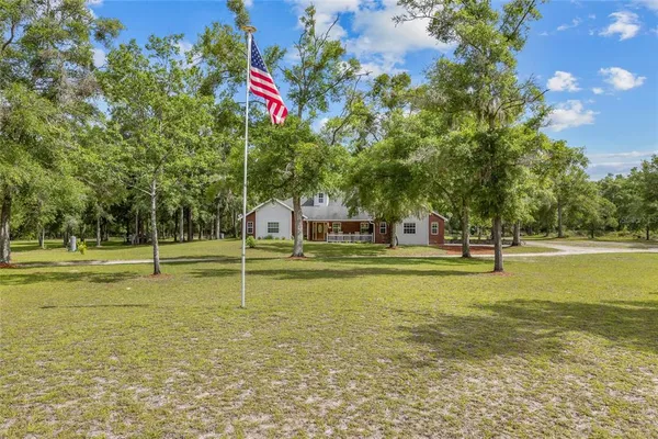 a house view with swimming pool